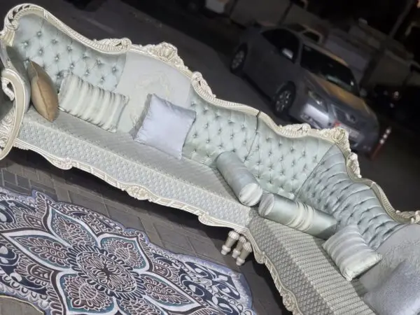 Comfortable used L-Shaped Sofa with cushions in Abu Dhabi