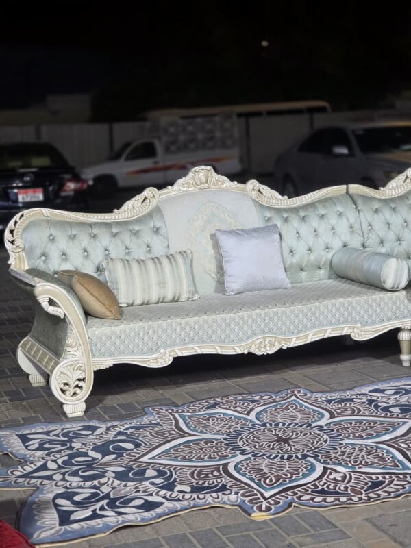 Comfortable used L-Shaped Sofa with cushions in Abu Dhabi
