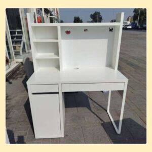 white wooden study table with shelves and cabinet