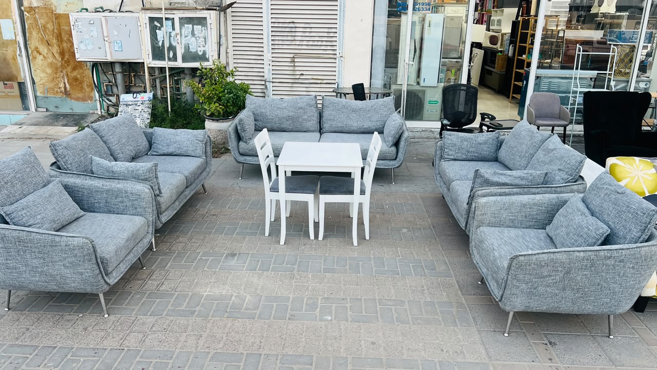 Modern grey fabric used sofa set in Abu Dhabi with chrome legs displayed at Fairy of Fortune store